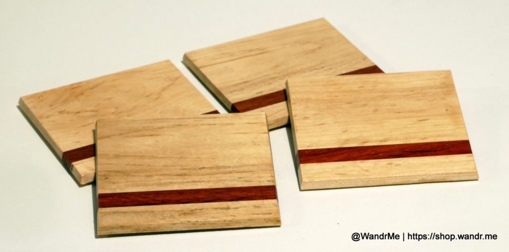 Perfect for your favorite cocktail or glass of wine, these handmade coasters feature Birdseye Maple and a Padauk accent.